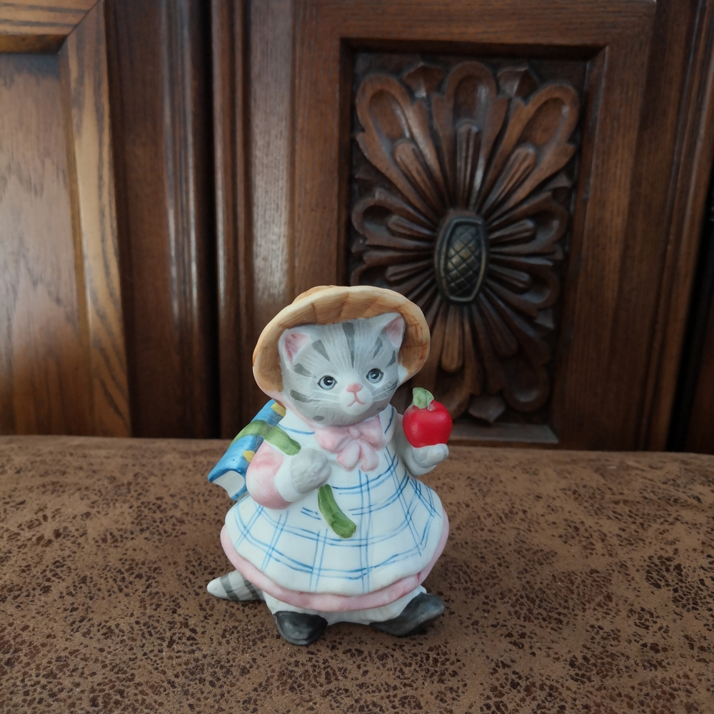 Adorable Cat Figurine with Apple and Hat